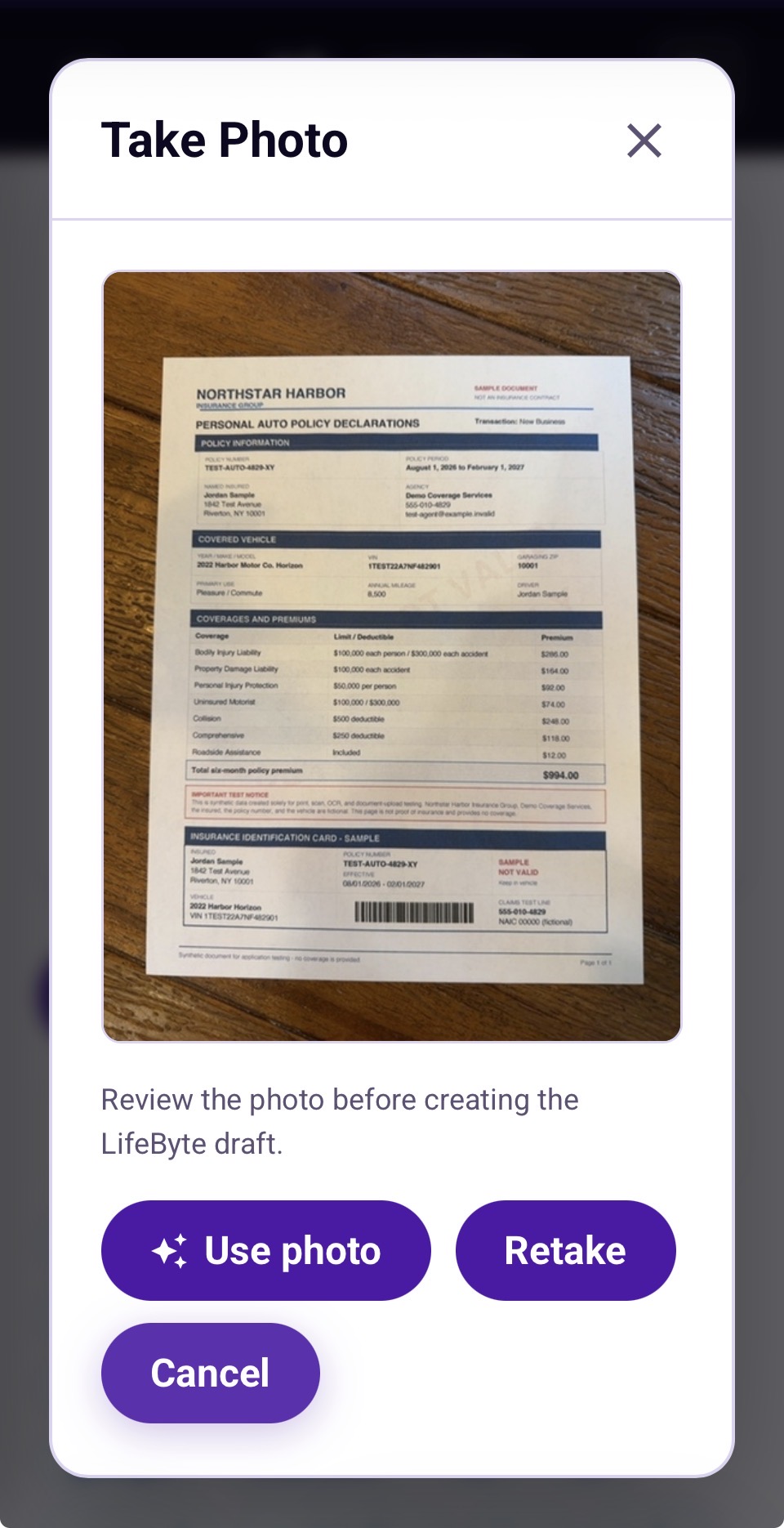 Photo review screen showing a captured insurance document with Use photo, Retake, and Cancel choices